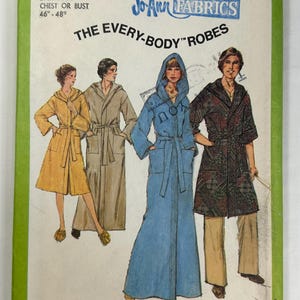 May include: A Simplicity 8275 sewing pattern envelope for The Every-Body Robes in size XX Large for a 46-48 inch chest or bust. The cover features illustrations of four different robe styles in yellow, tan, blue, and a dark patterned fabric.