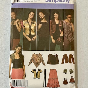 May include: A Simplicity sewing pattern envelope 4334 for sizes R5 14, 16, 18, 20, 22. The front displays photographs of various tops, jackets, and skirts, along with technical illustrations of the garments including a poncho, skirt, and accessories.