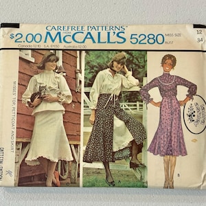 May include: Vintage McCall's 5280 sewing pattern featuring three different outfit designs. The pattern includes a top, petticoat, and skirt. The cover displays illustrations of the finished garments, with the Laura Ashley logo.