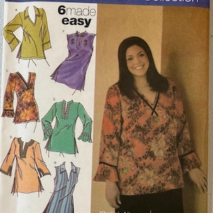 May include: Simplicity sewing pattern 4968 from the Khaliah Ali Collection. The pattern features six tunic designs with V-necklines and various sleeve styles. The cover shows a woman wearing a floral print tunic with black pants.