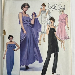 May include: Vogue American Designer sewing pattern 1896 by Edith Head. The envelope features illustrations of five different garment styles, including a long purple dress, a white patterned dress, a pink dress, a black tunic, and black trousers.