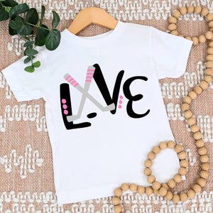 Love Hockey | Girl Hockey Player | T-Shirt One Piece Bodysuit | Female | Hockey Sticks | Hockey Puck