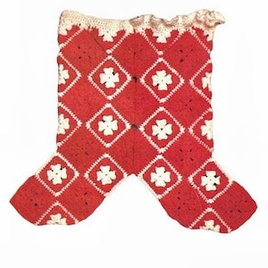 May include: Red crocheted baby booties with white flower designs.