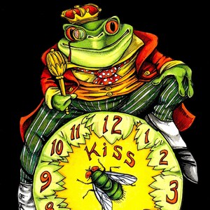 May include: A green frog wearing a red jacket, a yellow vest, and a crown sits on a yellow clock face with the words "Kiss Me" and numbers 1 through 12. The frog is holding a golden scepter.