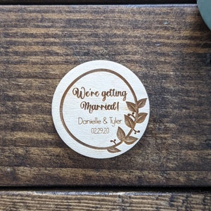 Wood wedding save the date magnet engraved with names and date