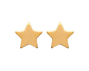 May include: A pair of gold star-shaped stud earrings.