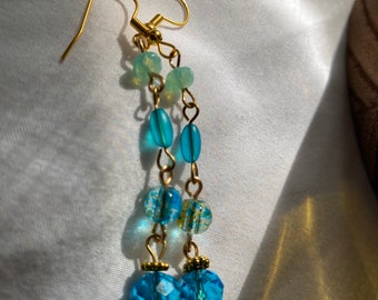 Blue glass dangle earrings on tarnish free gold colored wire