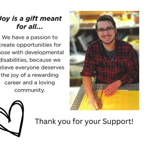 Pode incluir: Um jovem de camisa xadrez vermelha e preta sorri enquanto trabalha em um projeto artesanal. O texto "Joy is a gift meant for all..." e "Thank you for your Support!" &eacute; vis&iacute;vel na imagem.