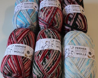 May include: Six balls of yarn in various colors, including red, green, blue, and white. Each ball has a label that reads "Ferner Mally Socks Weihnachts Edition Wolle".