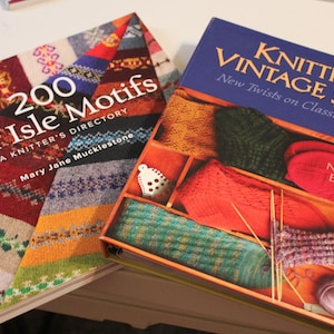 May include: Two knitting books, one titled "200 Fair Isle Motifs: A Knitter's Directory" and the other titled "Knitting Vintage Socks: New Twists on Classic Patterns".