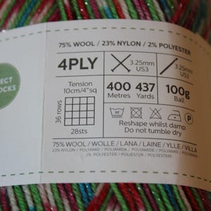 May include: A ball of 4-ply yarn with a label that reads "Perfect for Socks." The yarn is a mix of red, green, blue, and silver. The label includes information about the yarn's composition, weight, and recommended needle size.
