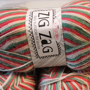 May include: A ball of red, white, and green yarn with the label "Zig Zag" and "4ply suitable for socks".