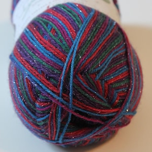 May include: A ball of colorful yarn with a mix of red, blue, purple, and green strands. The yarn has a subtle shimmer, adding a touch of sparkle. Ideal for knitting or crocheting projects.