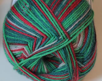 May include: A ball of yarn with a festive color scheme. The yarn features a mix of green, red, and white stripes, creating a visually appealing texture. Ideal for knitting or crocheting projects, this yarn is perfect for holiday-themed crafts.