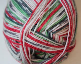 May include: A ball of yarn with a mix of red, white, green, and gray strands. The yarn is tightly wound, with the colors creating a striped pattern. The yarn is suitable for knitting or crocheting projects.