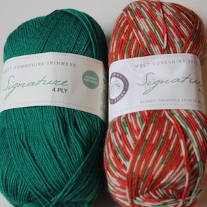May include: Two skeins of West Yorkshire Spinners Signature 4 Ply yarn. One is a solid emerald green, the other is a variegated mix of red, orange, white, and green. The labels read "Perfect for Socks".