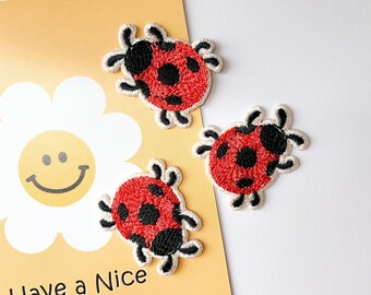 thumbnail image 2 of Ladybird Flower Patch – Embroidered Iron-On/Sew-On Badge (UK Theme) 2 of 6