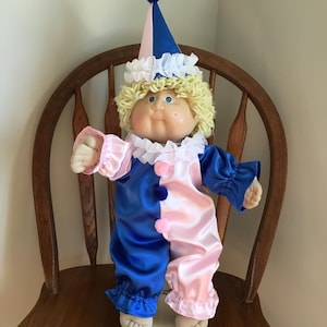 May include: A set of three ceramic mugs with a speckled, matte finish. The mugs are in shades of cream, light gray, and dark gray. Each mug has a simple, minimalist design, perfect for coffee or tea.