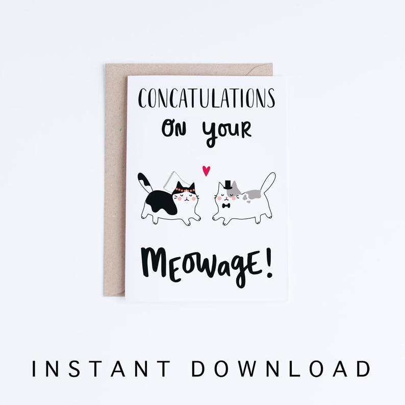 May include: A white card with black text that reads "CONCATULATIONS on your MEOWage!"  Two cartoon cats are pictured, one black and white and one gray and white, wearing wedding attire. A red heart is above the cats.