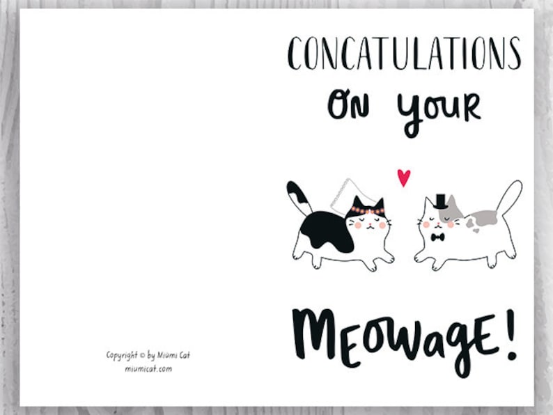 May include: A white card with black text that says "CONCATULATIONS on your MEOWAGE!"  Two cartoon cats are shown, one wearing a wedding veil and the other wearing a top hat. A red heart is above the cats.