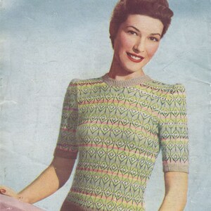 May include: A vintage knitting pattern cover showing a woman in a pastel Fair Isle sweater. The sweater features a geometric pattern in green, pink, and yellow. The cover displays the text "PASTEL FAIR ISLE" and "WELDONS A745".
