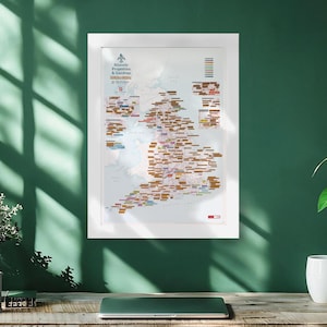 May include: A framed map titled Historic Properties & Gardens featuring a detailed illustration of Great Britain. The map displays numerous small colored rectangular labels across the landmass, a legend in the top right corner, and text.