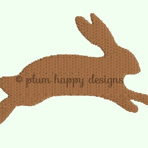 May include: A brown silhouette of a rabbit jumping, with the text "plum happy designs" in the center.