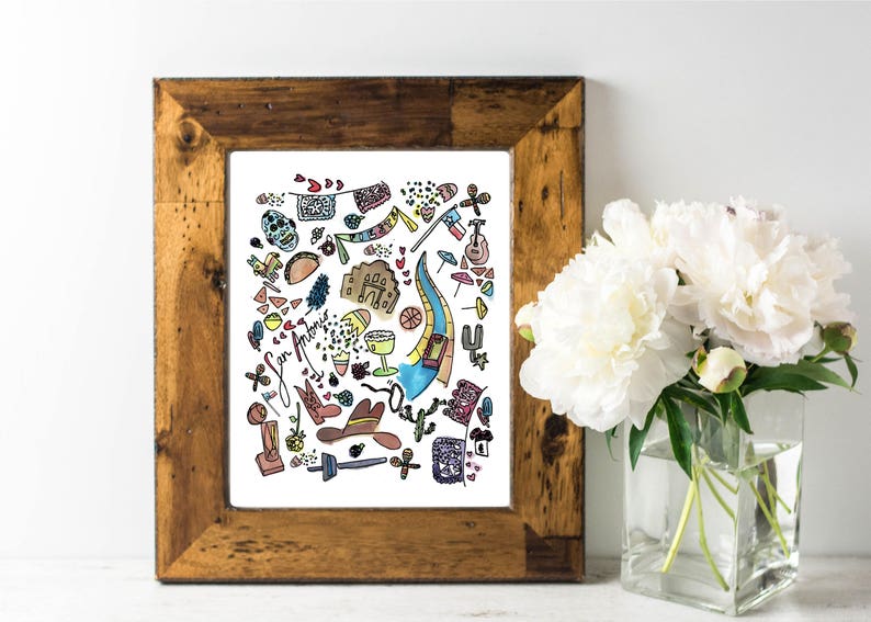 May include: A framed print with a watercolor illustration of San Antonio landmarks and icons. The artwork includes a mission, a guitar, a cowboy hat, and the text "San Antonio". The frame is made of rustic wood.