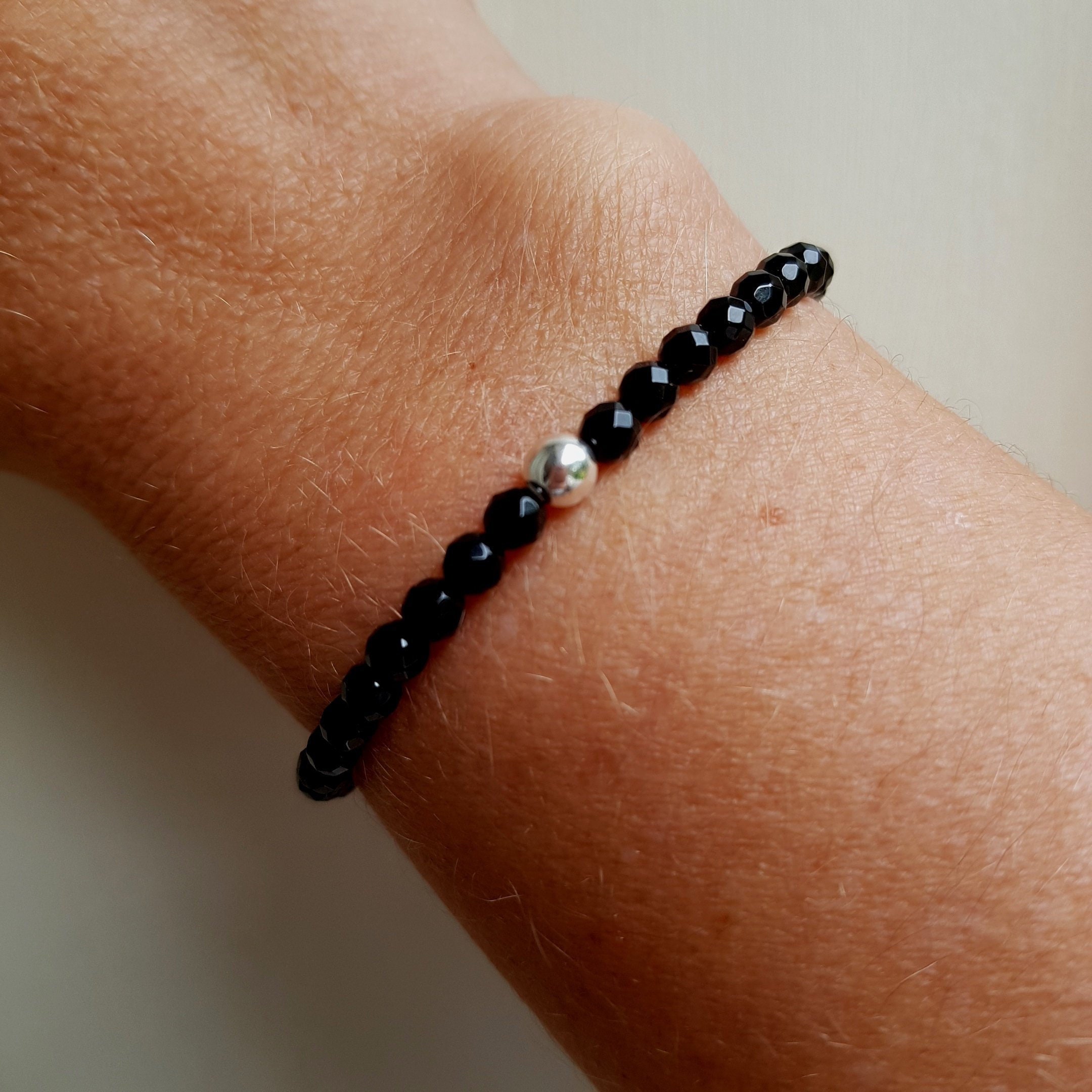 Bracelet with shop one black bead