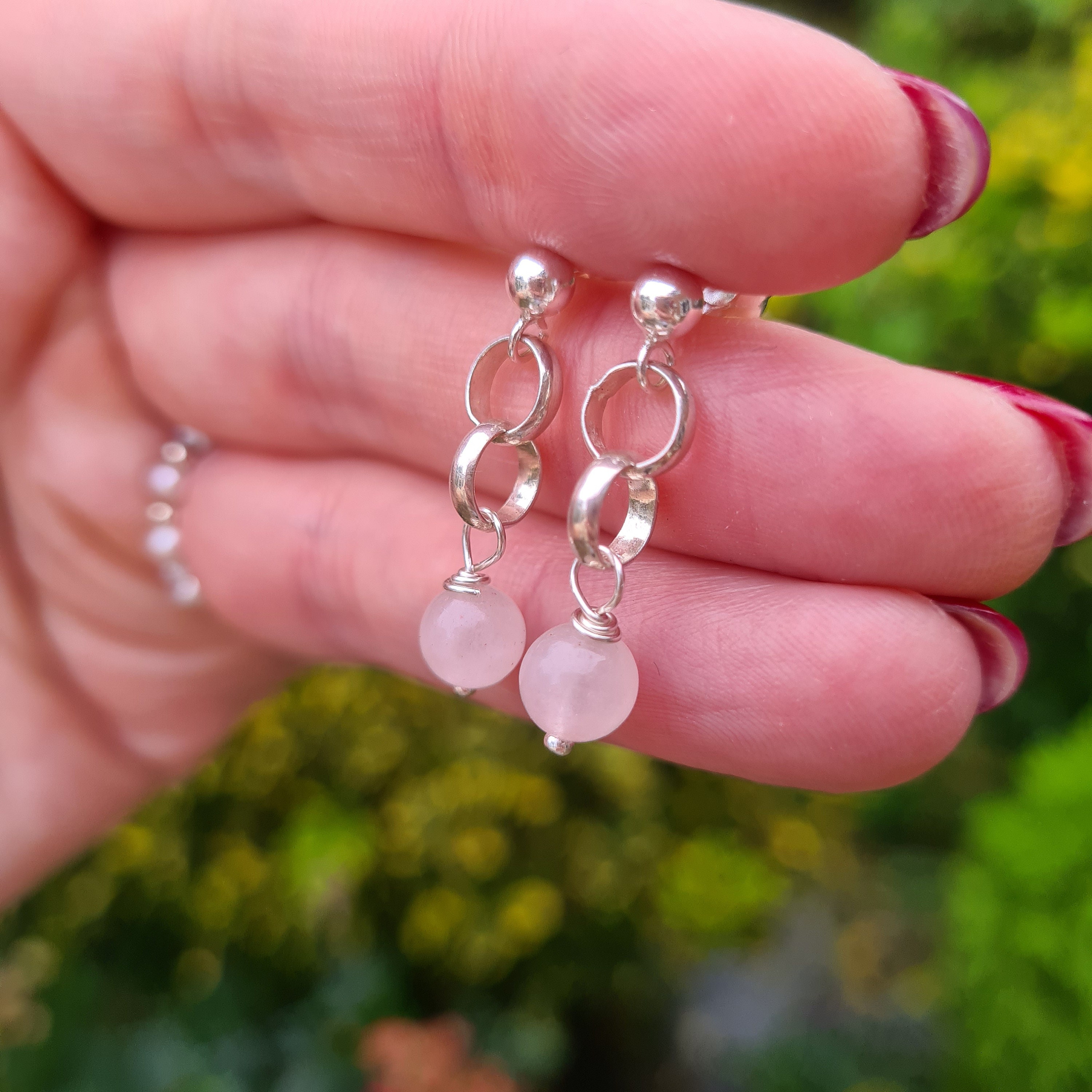 Silver rose shop drop earrings