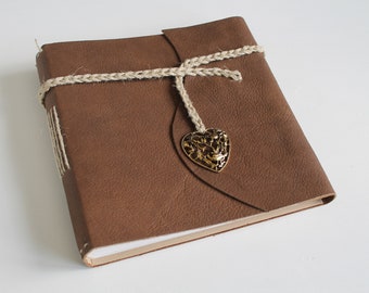 Guest book album with golden heart made of brown leather