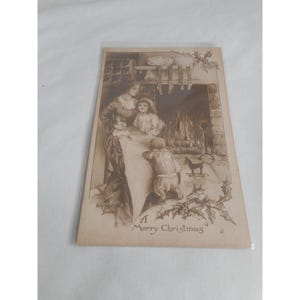 Postal navideña vintage sin pegar escrita Familia Niño Chimenea Gibson Art Co