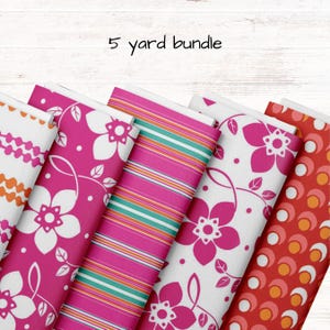 May include: A 5 yard bundle of fabric featuring five different patterns. The patterns include a pink and white floral design, a pink and white striped design, a red and orange geometric design, and two more pink and white floral designs.