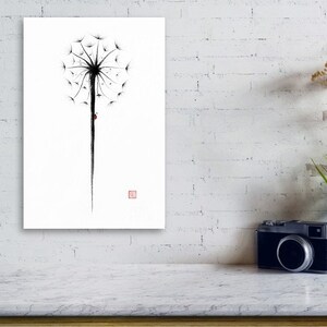 May include: A minimalist black and white dandelion art print. The artwork features a detailed dandelion seed head with a long stem and a small red accent. The print is displayed on a white wall, creating a striking contrast.
