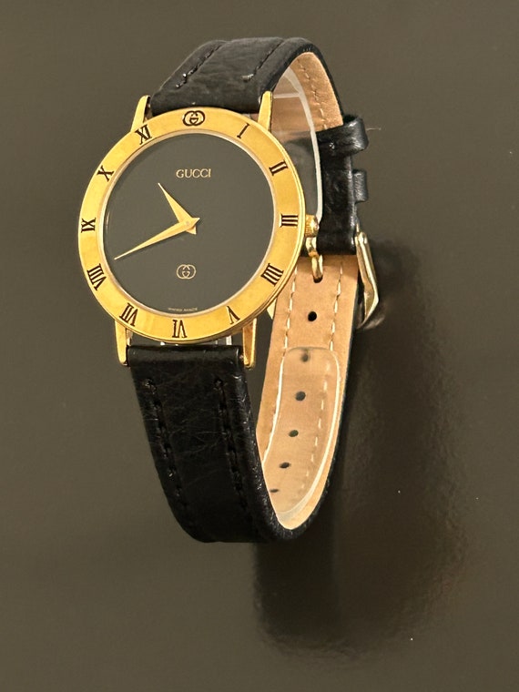 Gucci mens handsome gold watch with a  8" black w… - image 2