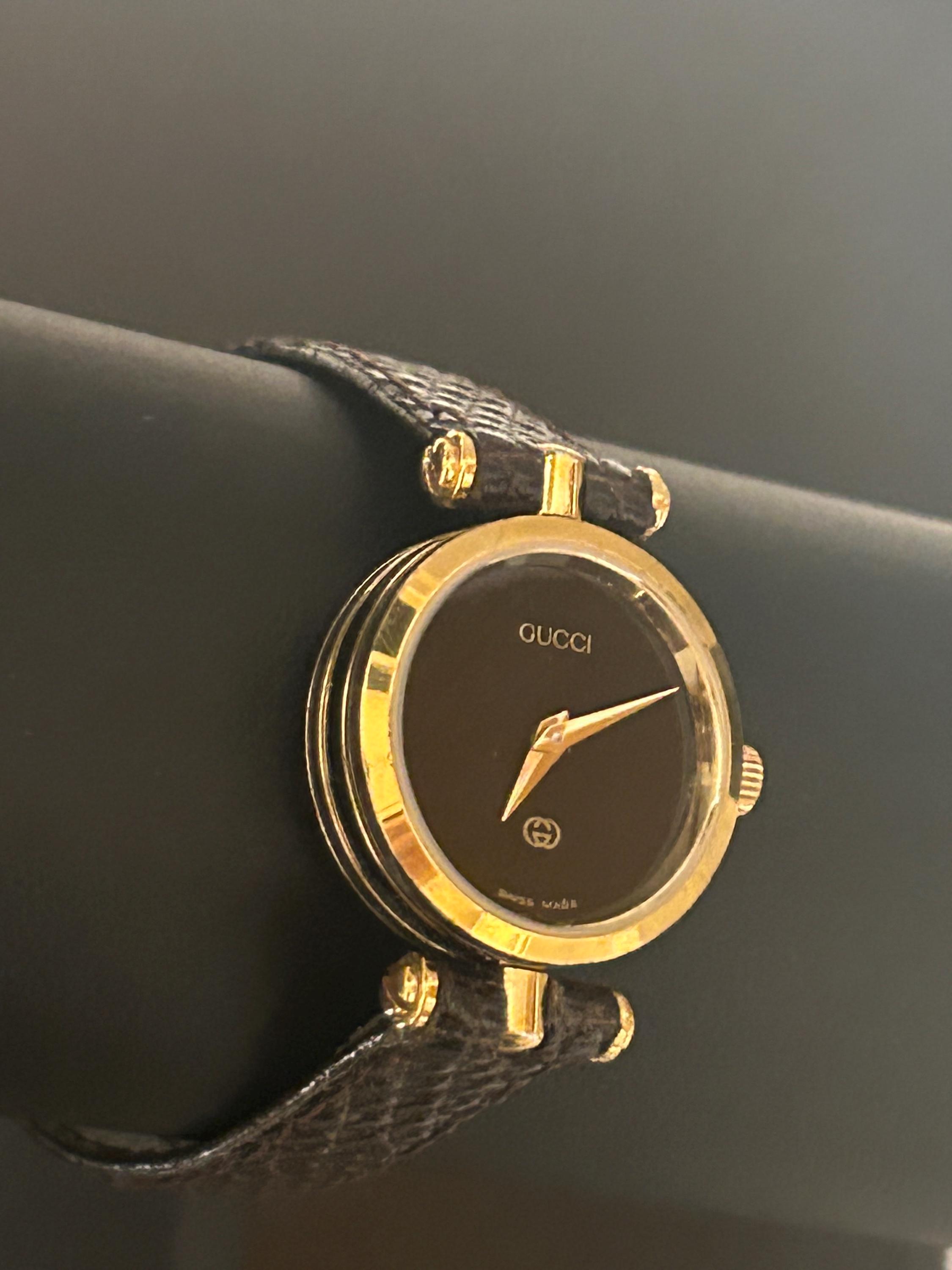 Gucci Lovely Ladies 6 1/2” Gold-blk Timepiece With a New  display picture 2