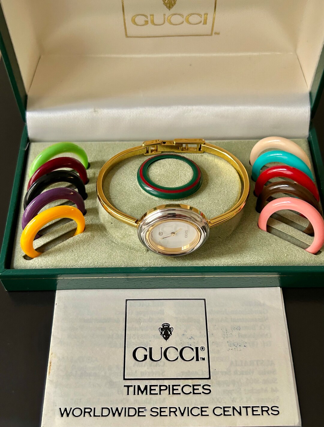 Gucci Fine 6 1/2 Authentic Women's Gold Bangle Watch 12 Gucci Bezels