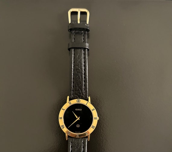 Gucci mens handsome gold watch with a  8" black w… - image 3