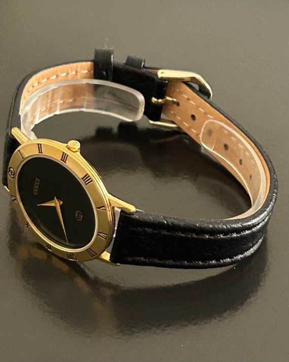 Gucci mens handsome gold watch with a  8" black w… - image 9