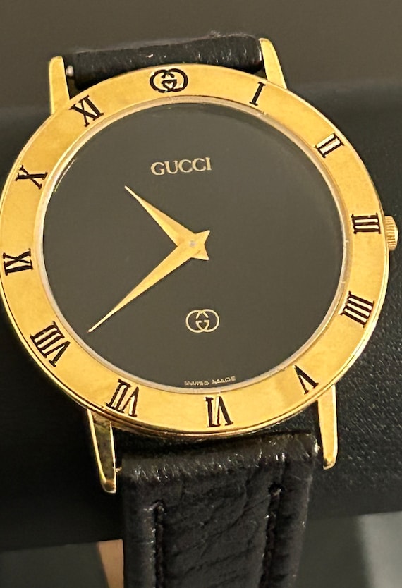 Gucci mens handsome gold watch with a  8" black w… - image 1