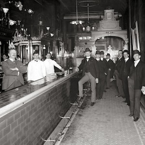Gentlemen At The Bar, 1910. Vintage Photo Reproduction Print. Black & White Photo. Saloon, Pub, Tavern, Beer, Wine, Whiskey.