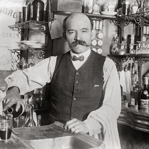 Bartender Pouring Drink, 1910. Vintage Photo Reproduction Print. Black & White Photograph. Bar, Pub, Saloon, Beer, Wine, Historical.