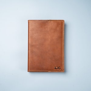 Hand Made Full Grain leather journal cover that comes with a 192 page A5 journal. This journal is handmade and can be personalized with your name or your initials!  Available in cow hide (smooth) and shrunken bison (textured)