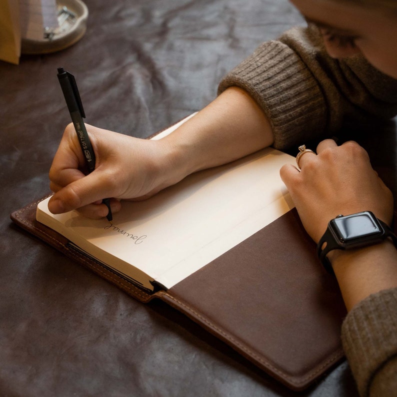 Hand Made Full Grain leather journal cover that comes with a 192 page A5 journal. This journal is handmade and can be personalized with your name or your initials!  Available in cow hide (smooth) and shrunken bison (textured)