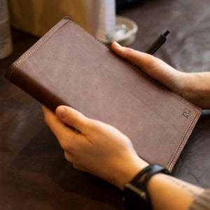 Hand Made Full Grain leather journal cover that comes with a 192 page A5 journal. This journal is handmade and can be personalized with your name or your initials!  Available in cow hide (smooth) and shrunken bison (textured)