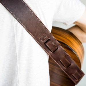 Personalized fine leather guitar strap. Available in black or brown leather.