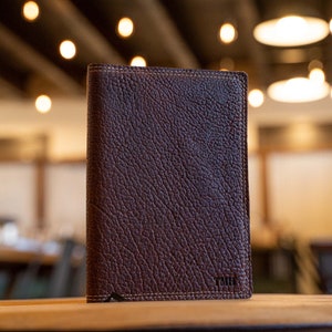 Hand Made Full Grain leather journal cover that comes with a 192 page A5 journal. This journal is handmade and can be personalized with your name or your initials!  Available in cow hide (smooth) and shrunken bison (textured)