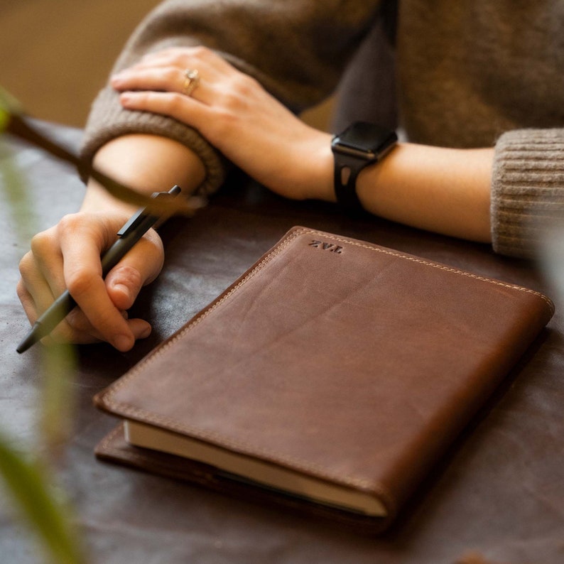 Hand Made Full Grain leather journal cover that comes with a 192 page A5 journal. This journal is handmade and can be personalized with your name or your initials!  Available in cow hide (smooth) and shrunken bison (textured)