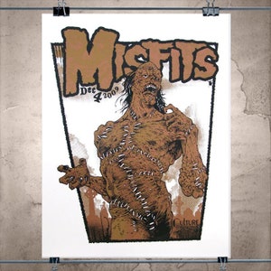 May include: A poster featuring the word "MISFITS" in brown block letters above a brown illustration of a stitched-up monster. The poster includes the date "Dec 4 2009" and the word "CULTURE".