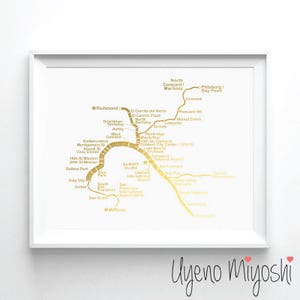 May include: A gold foil print of the San Francisco Bay Area public transportation map with the text "Uyeno Miyoshi" at the bottom.